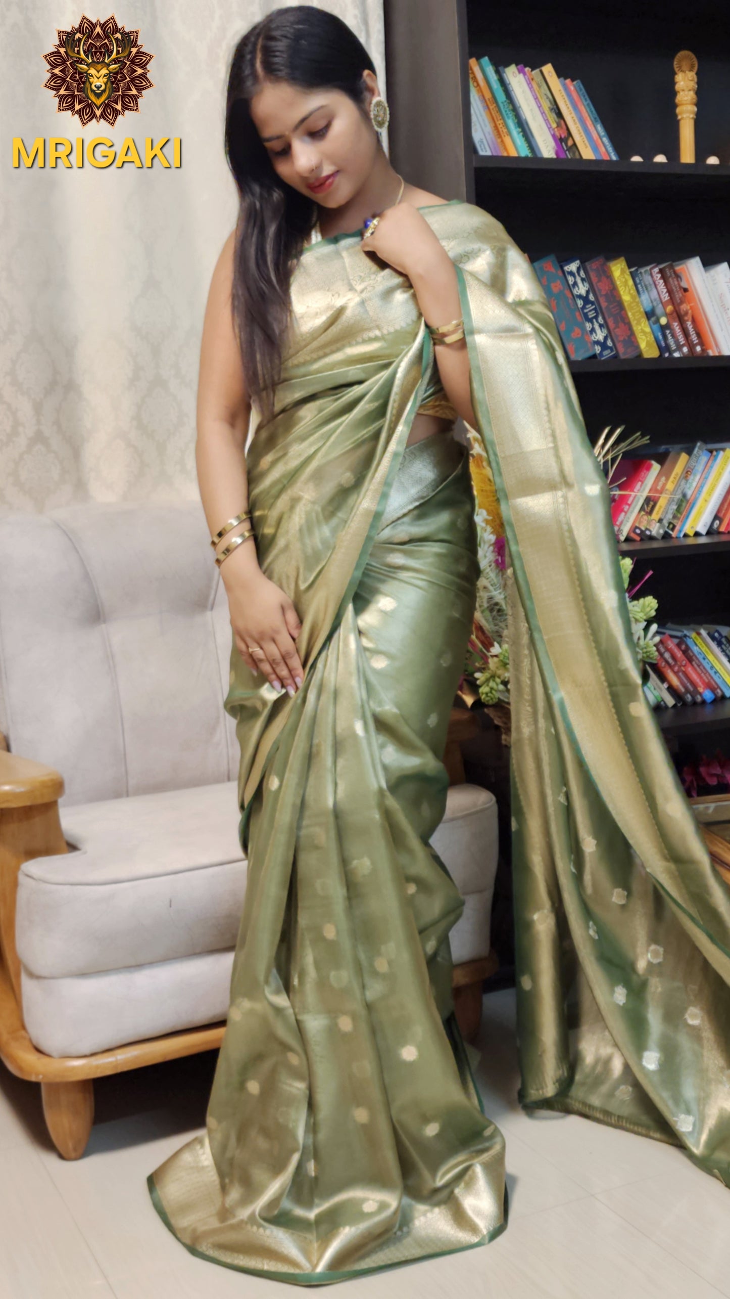 Elegant Tissue Silk Olive Green color Saree with Banarasi Zari Border