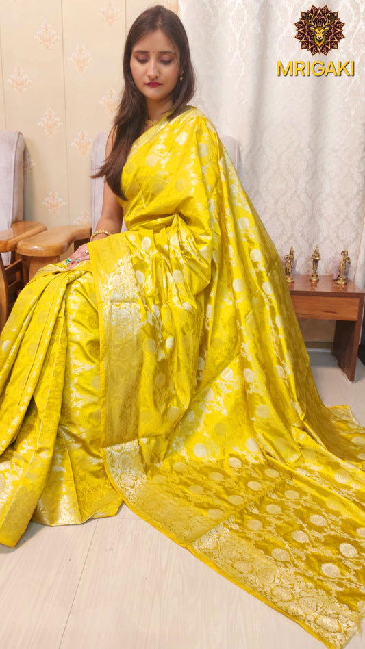 Yellow color Pure Dupion Silk Banarasi Saree with Silver Jaal all over