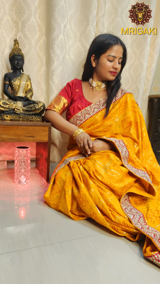 Yellow color Bandhej Saree with contrast Red gotta border & designer unstitched blouse piece
