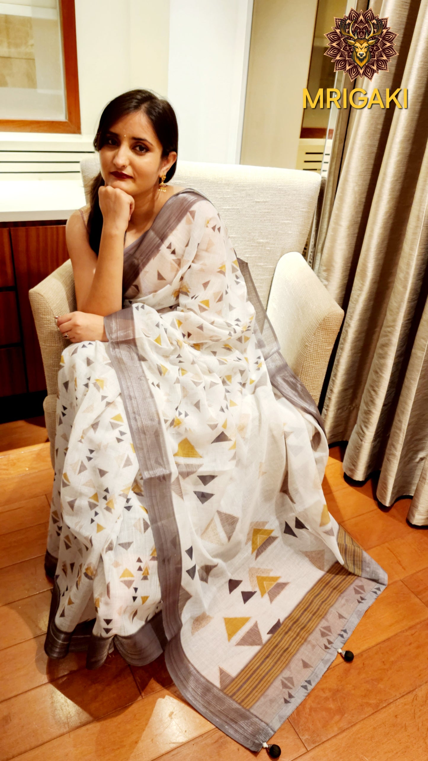White Base Linen Saree with Triangular Grey digital design all-over, dark grey border with Pom-Pom on Pallu