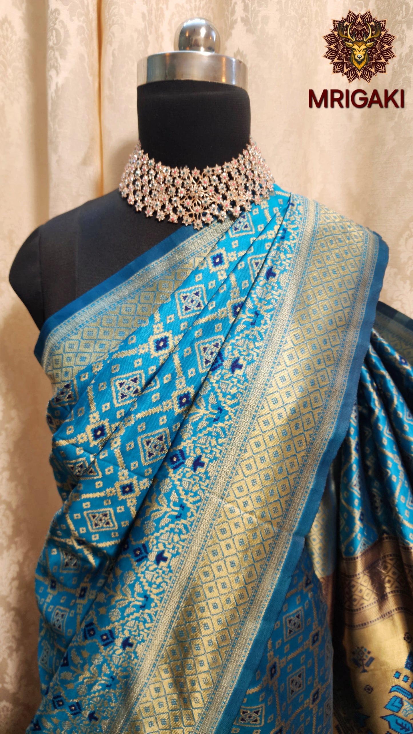 Warm Silk  Saree in Turquoise Blue color with geometrical print all over & Patola Print Pallu